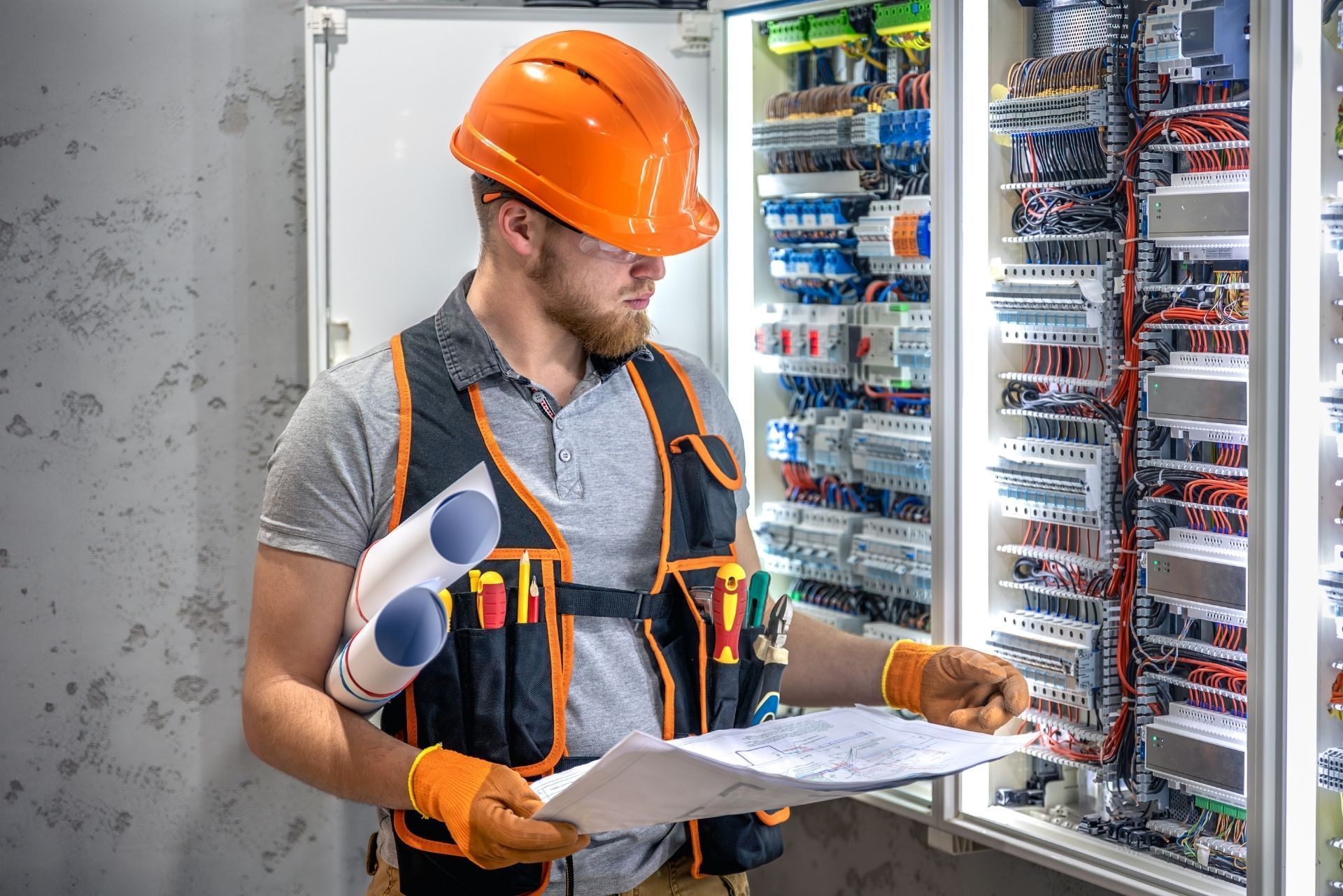 HVAC technician wearing mask and hard hat, working on AC units on a rooftop. HVAC technician wearing mask and hard hat, working on AC units on a rooftop.