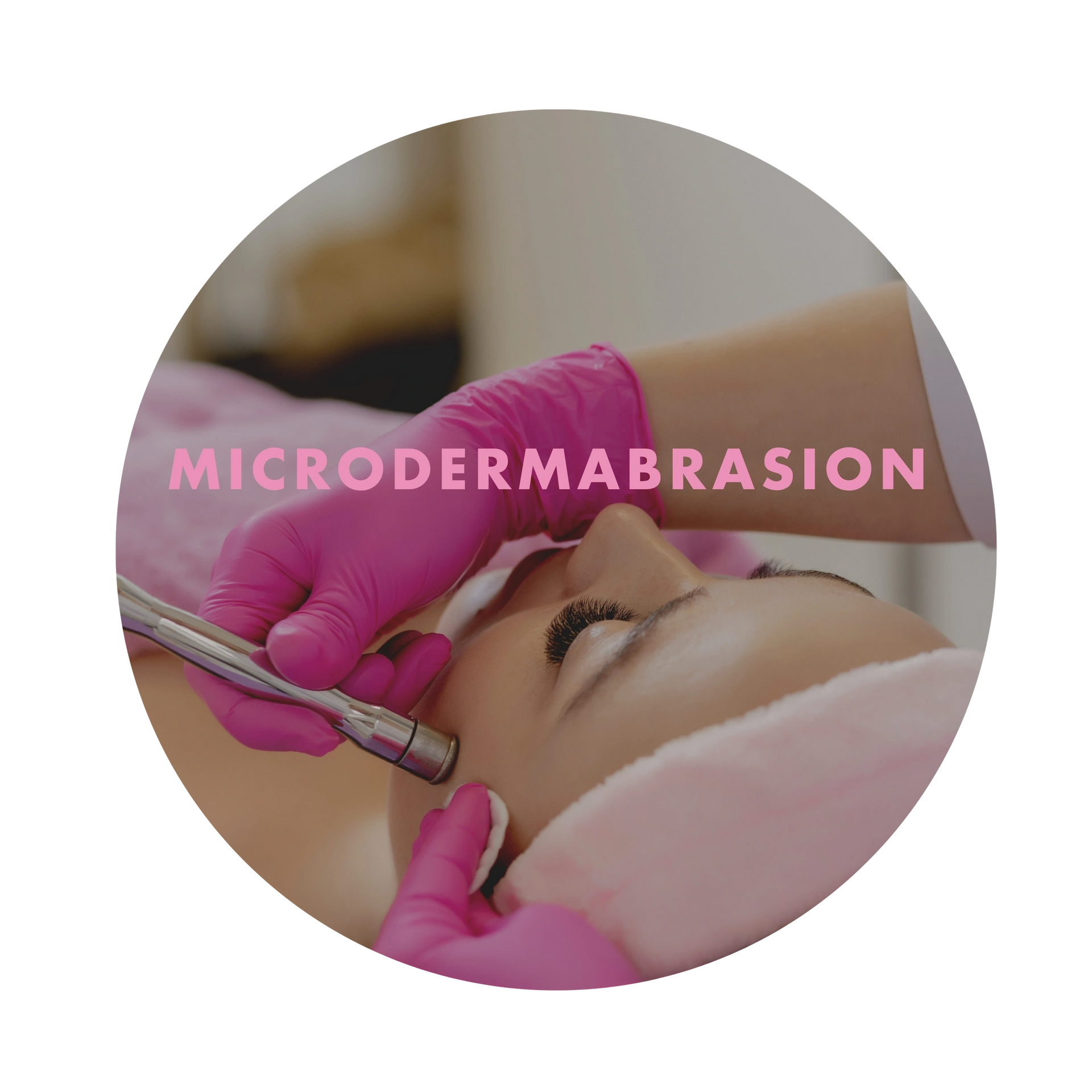 A woman is getting a microdermabrasion treatment on her face