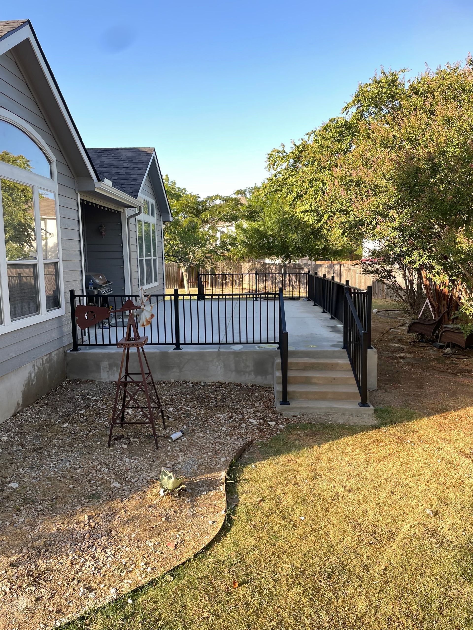 concrete work patio and metal rails waco