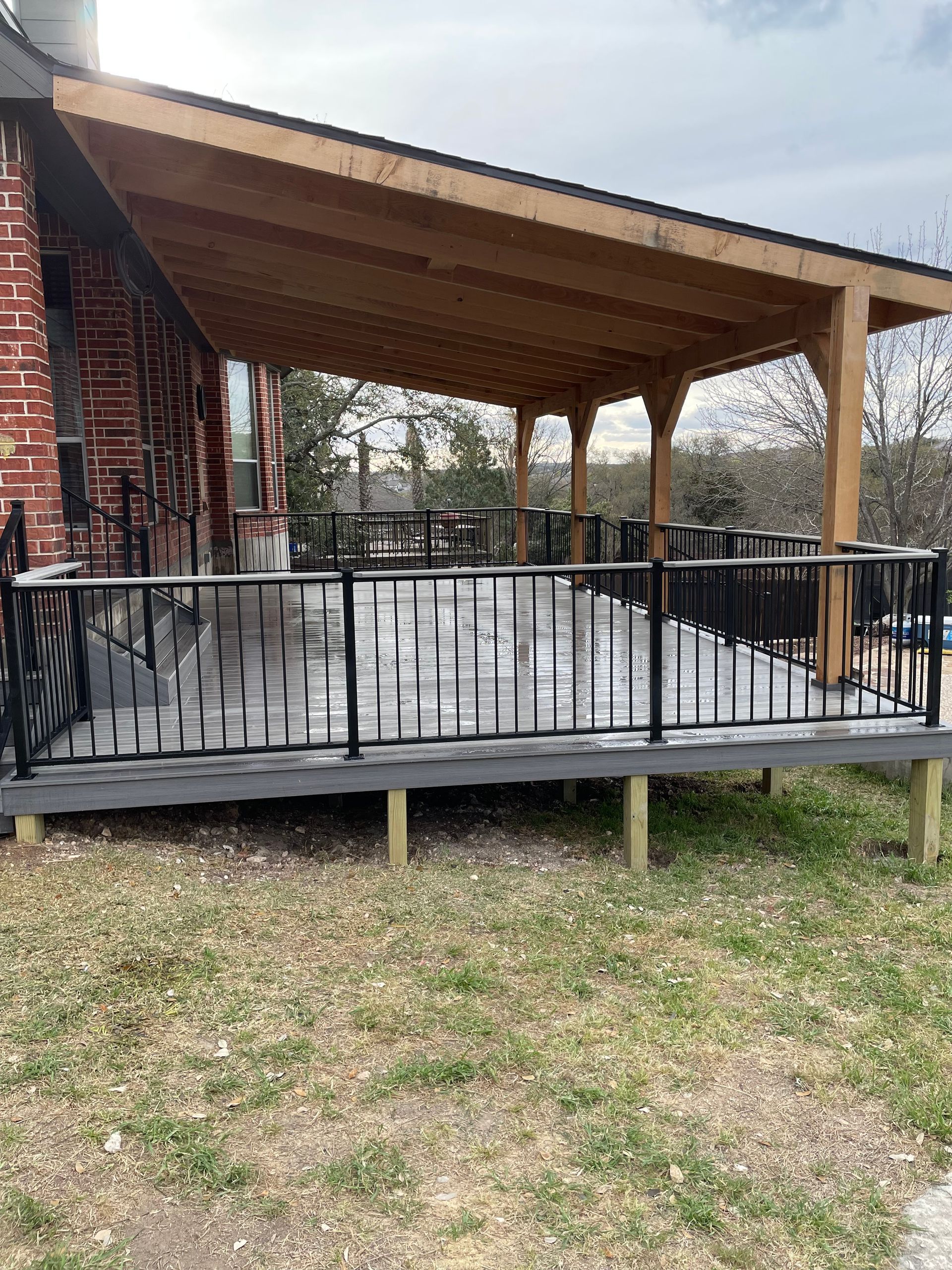beautiful gray deck with railing