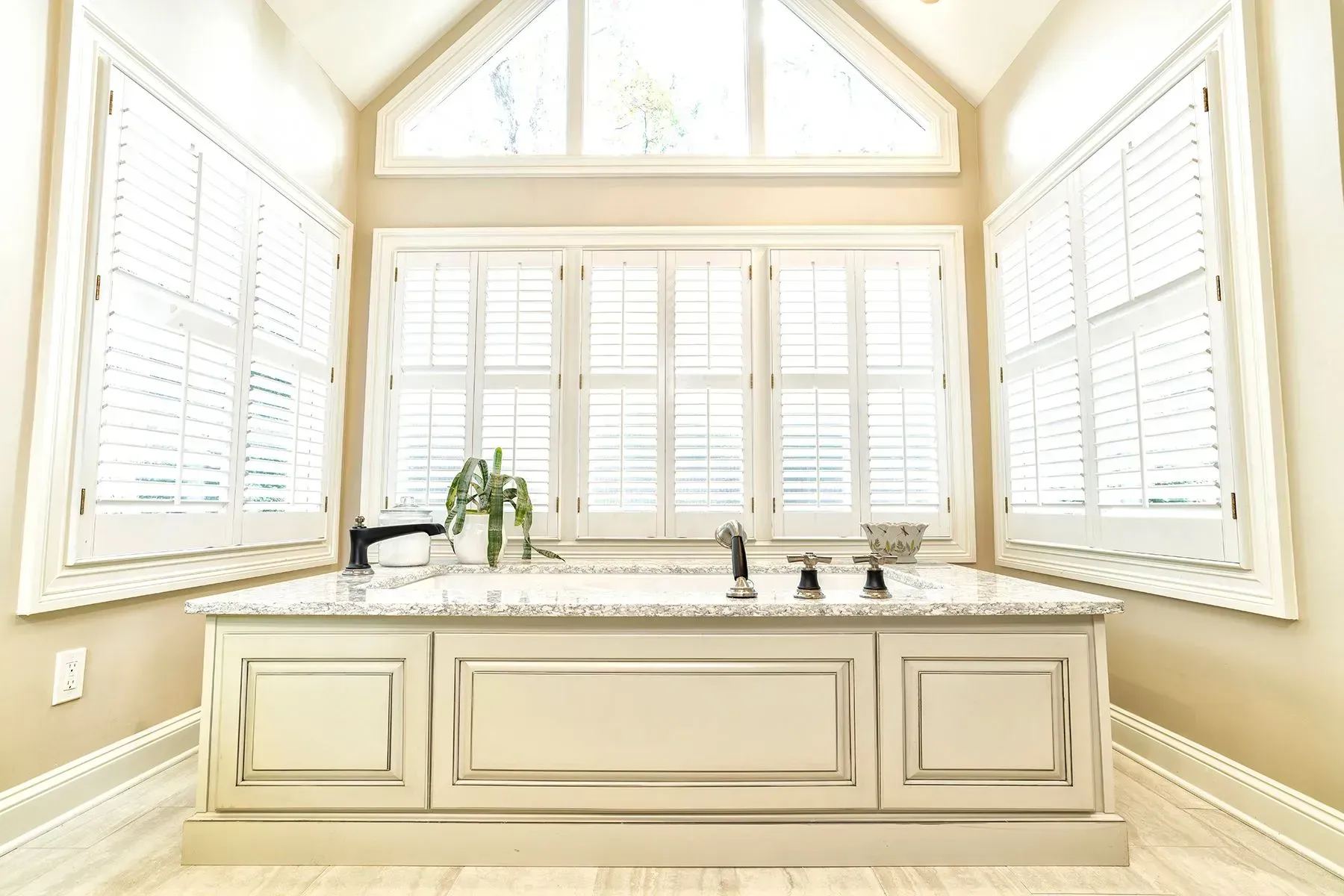 Bathroom remodel in Greenville, South Carolina: soaking tub window custom vanity