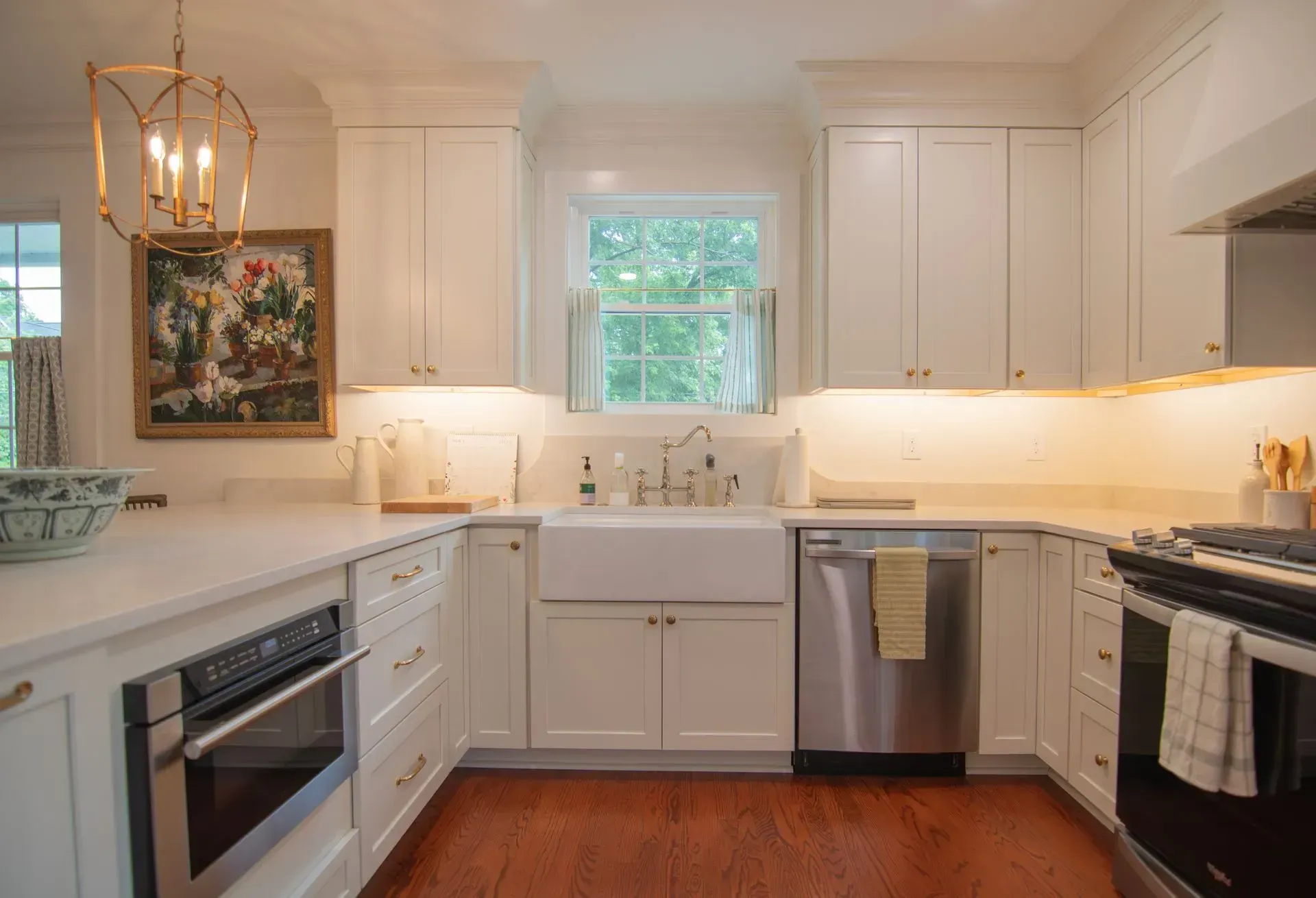 Kitchen remodel in Greenville, South Carolina: white cabinets farmhouse sink lantern lights