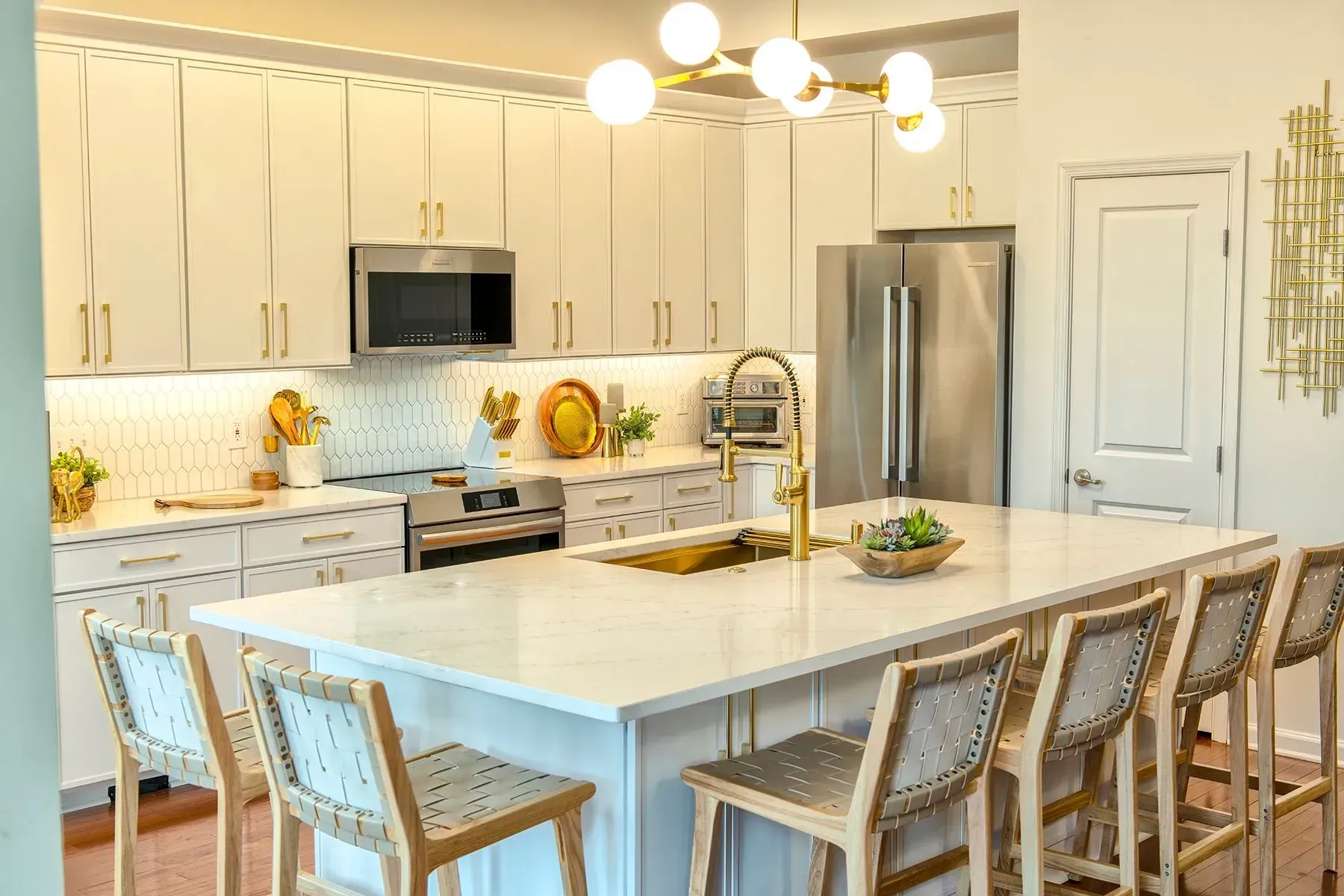 Kitchen remodel in Greenville, South Carolina: brass fixtures white cabinets