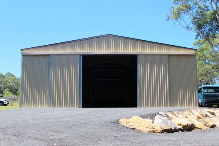 A large metal building with a large sliding door