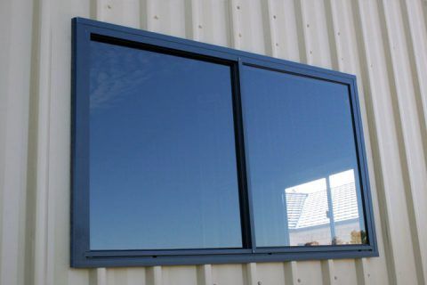 A large window is on the side of a building.