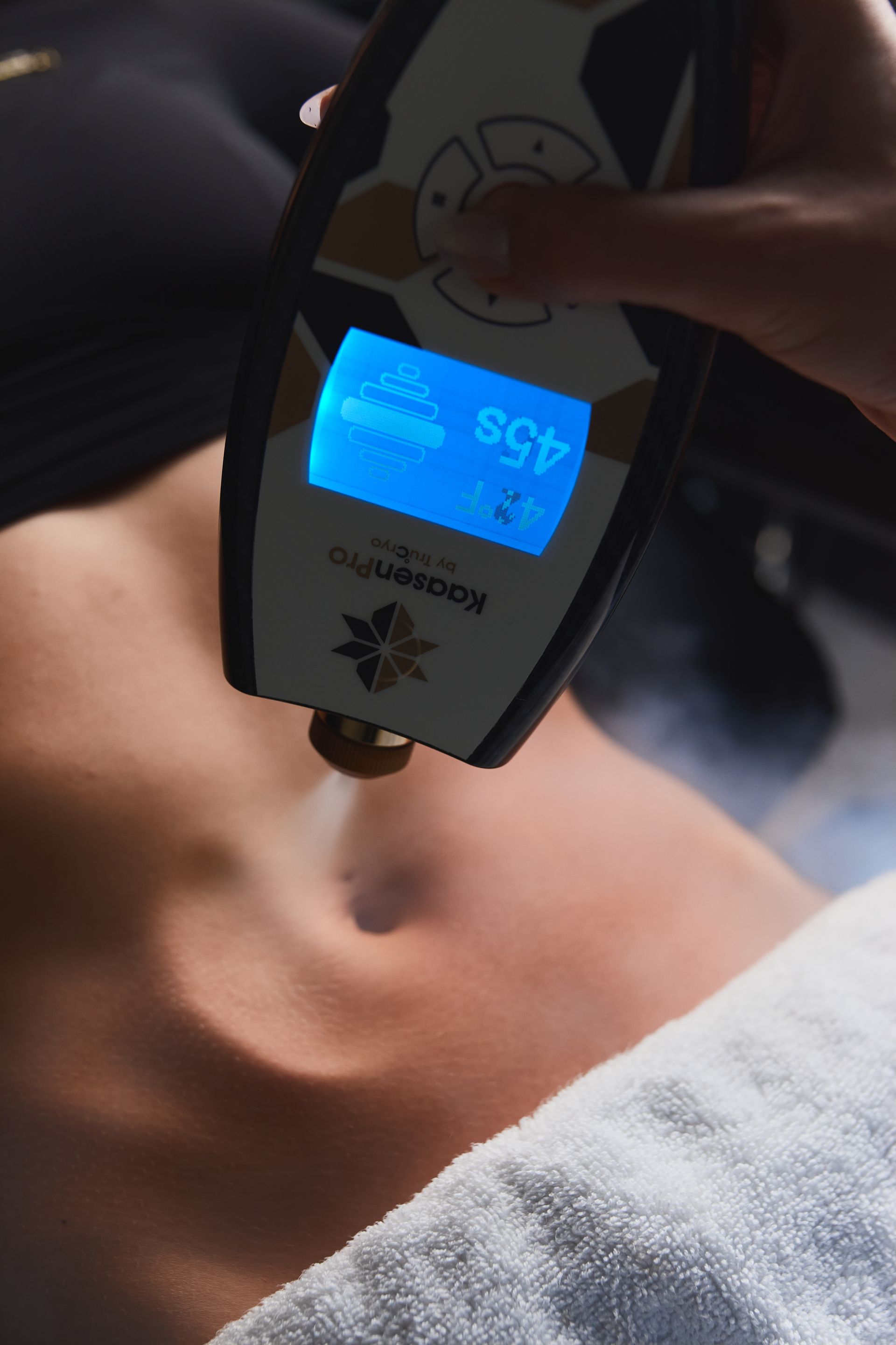 Device held over torso with screen displaying