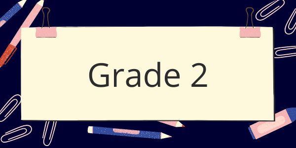 A sign that says grade 2 is surrounded by school supplies.