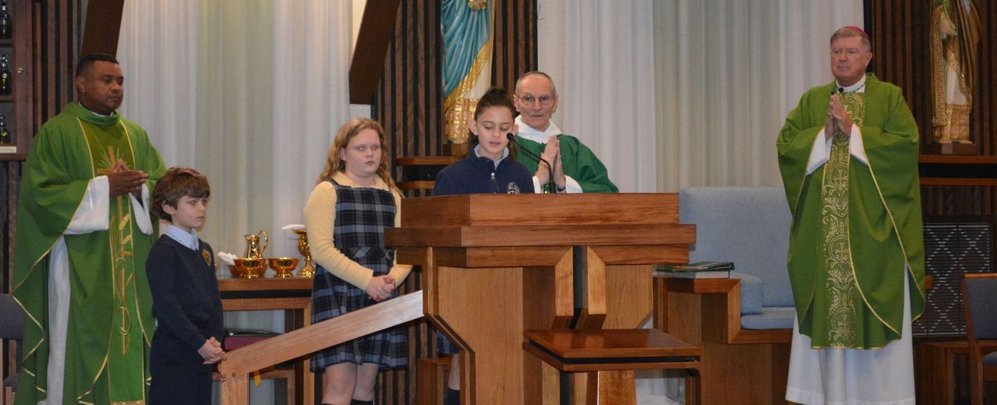 A group of people standing around a podium in a church