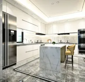 Modern white kitchen with marble accents. Stainless steel appliances, a center island with a stool, and marble flooring.