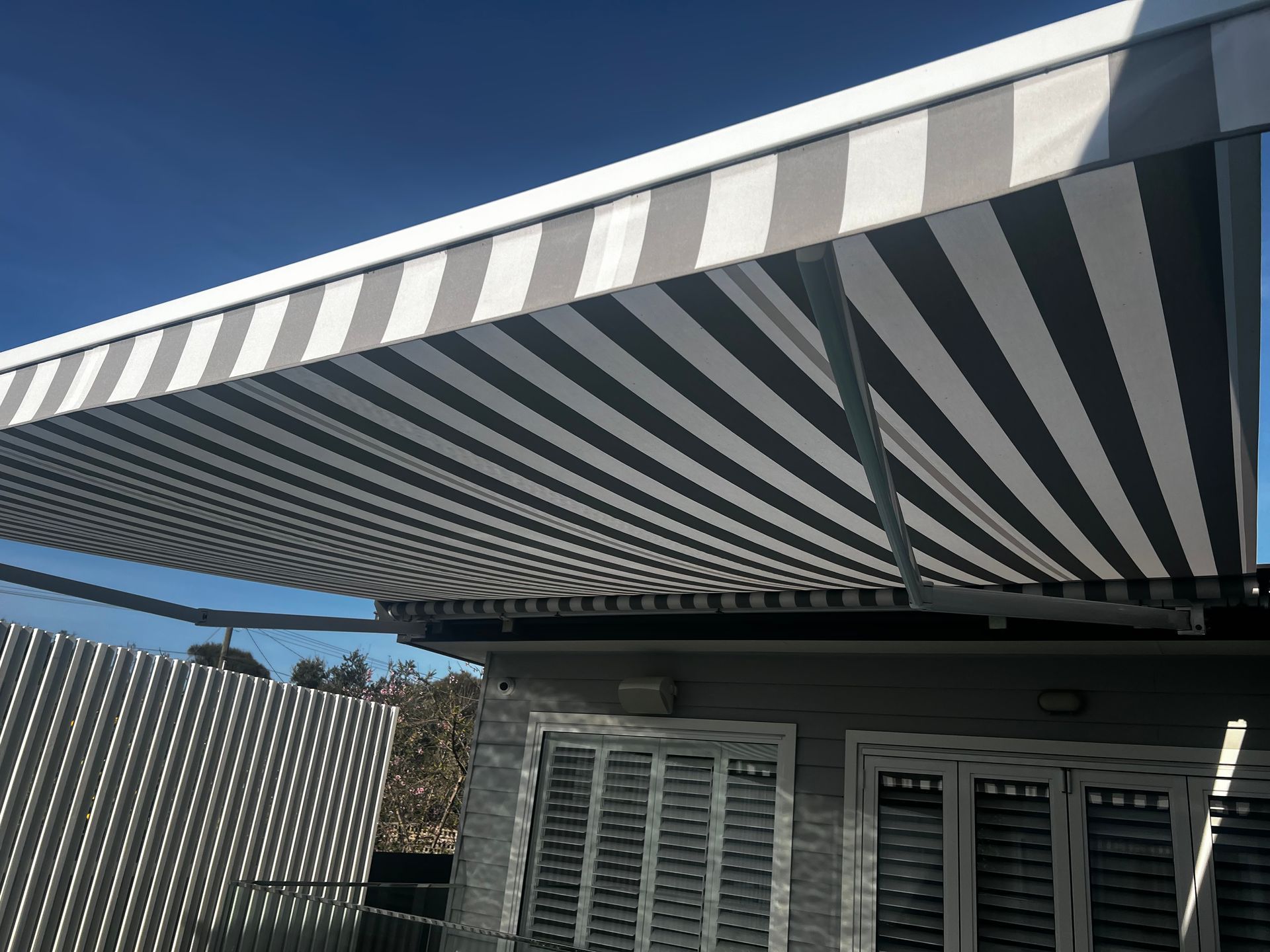 Grey and White with Folding Arm Awnings - Blairgowrie, VIC - Curtains & Blinds by Dannielle Harris