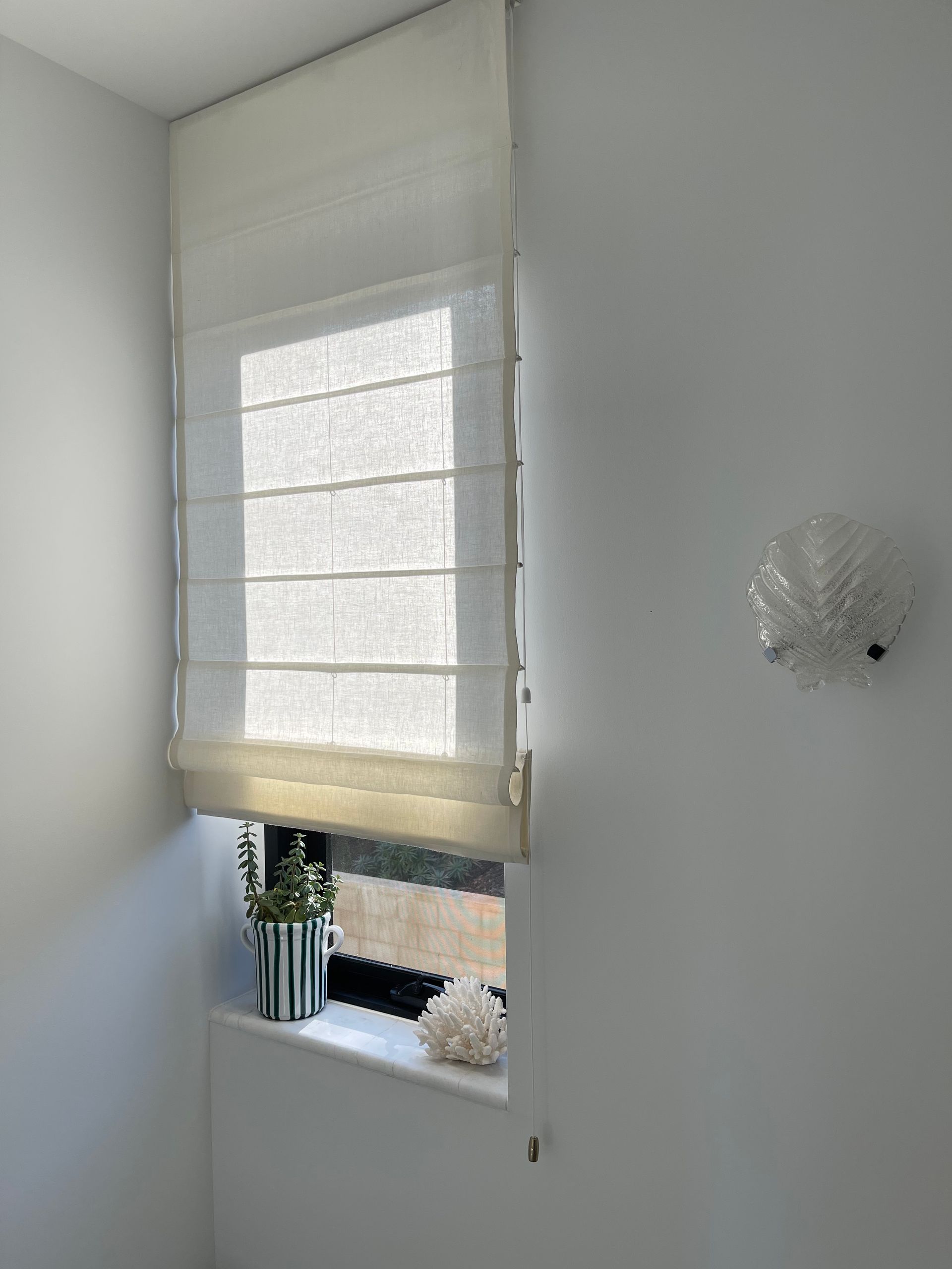 White Roman Blind With Plants Below - Blairgowrie, VIC - Curtains & Blinds by Dannielle Harris