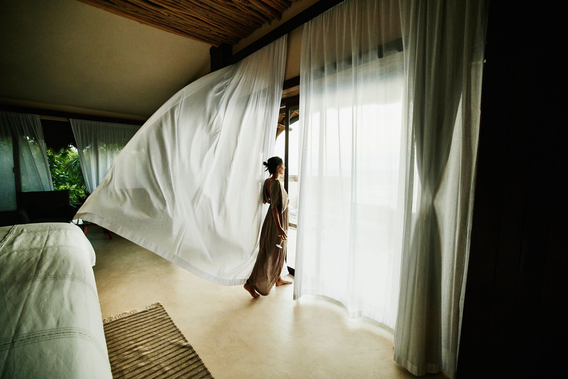 Woman and White Curtain Blowing Up by Wind - Blairgowrie, VIC - Curtains & Blinds by Dannielle Harris