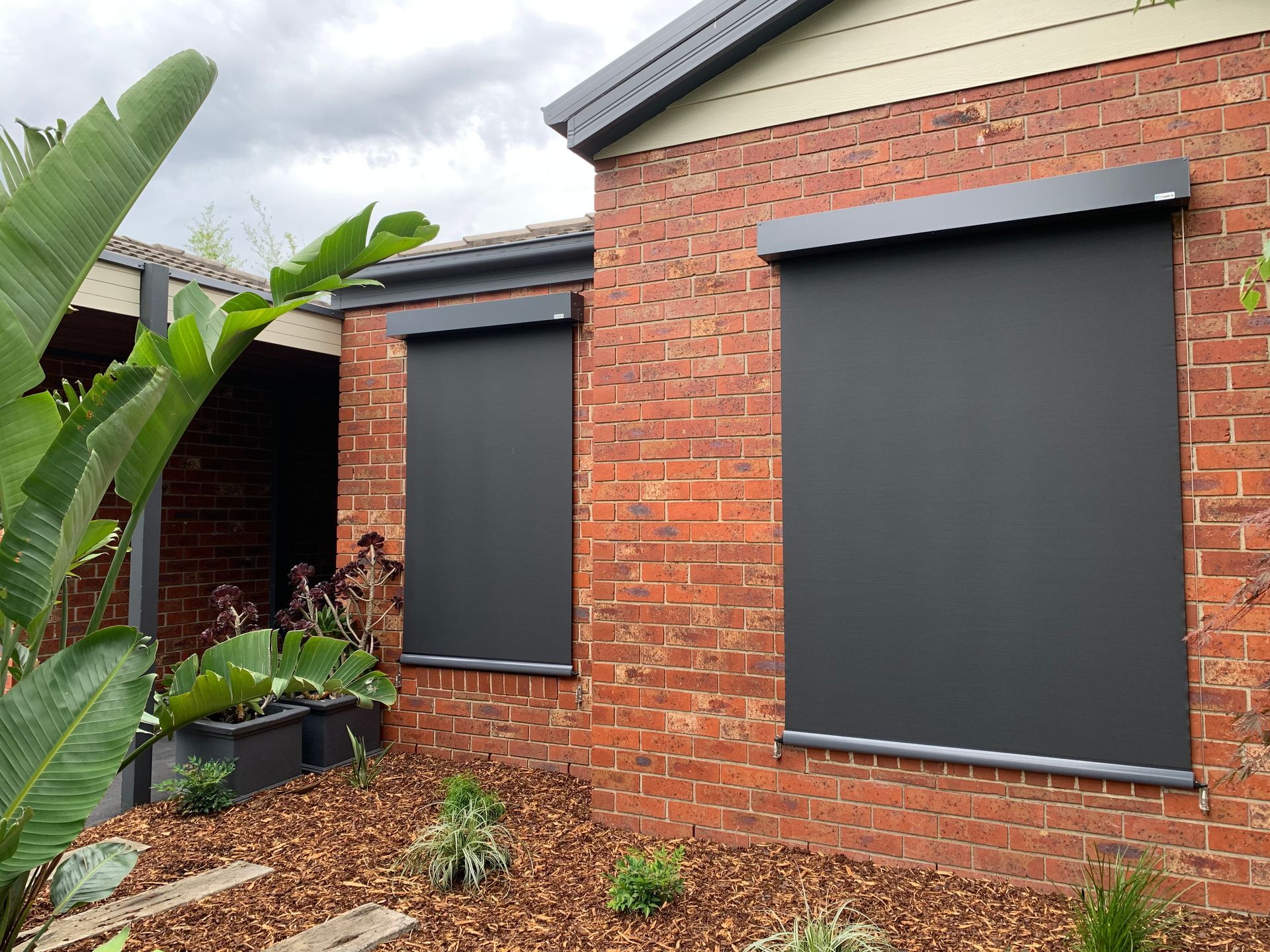 Grey Awnings on a Orange Brick Home - Blairgowrie, VIC - Curtains & Blinds by Dannielle Harris