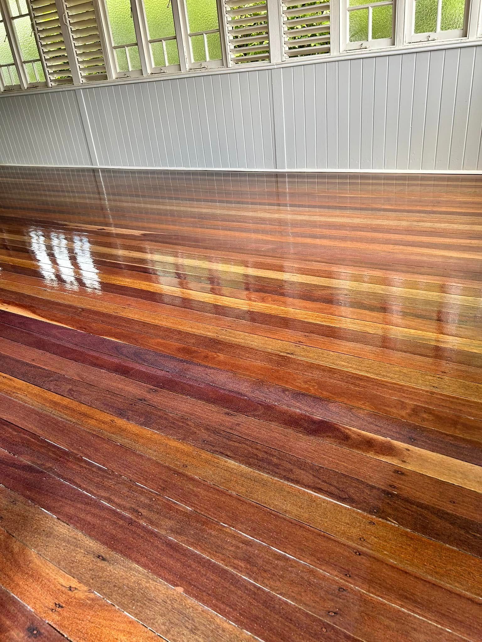 Shiny, Multi-toned Wooden Floor — Scott Johnston Floor Sanding in Port Douglas, QLD