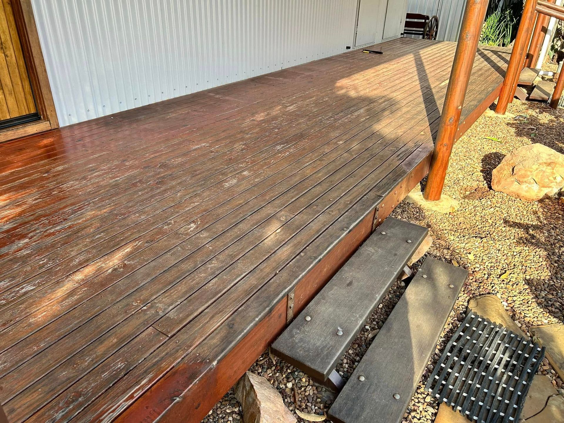 Wooden Deck With Strong Shadows From Pillars — Scott Johnston Floor Sanding in Bentley Park QLD