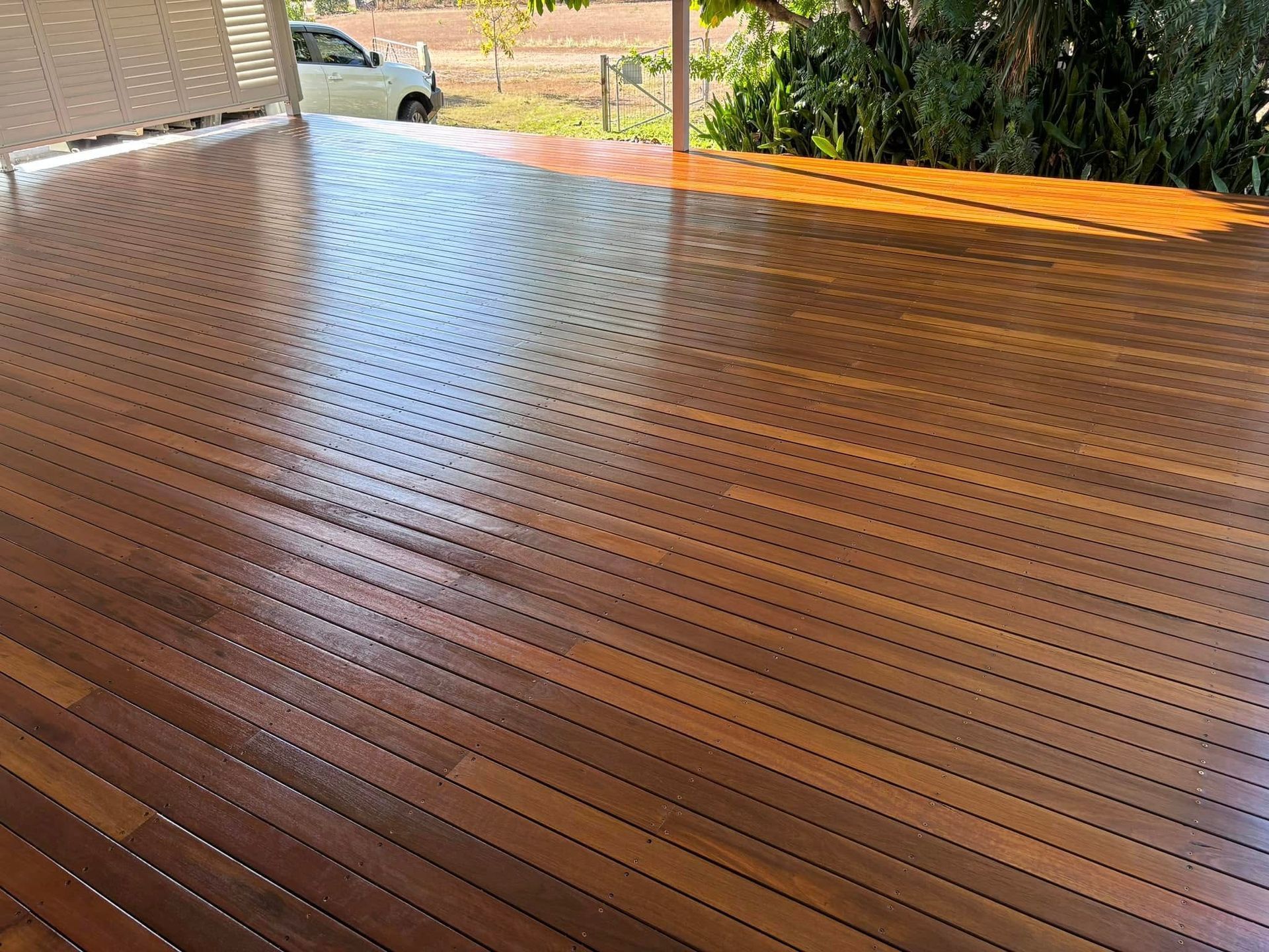 Wooden Veranda With Railing, Overlooking Lush Greenery — Scott Johnston Floor Sanding in Bentley Park QLD