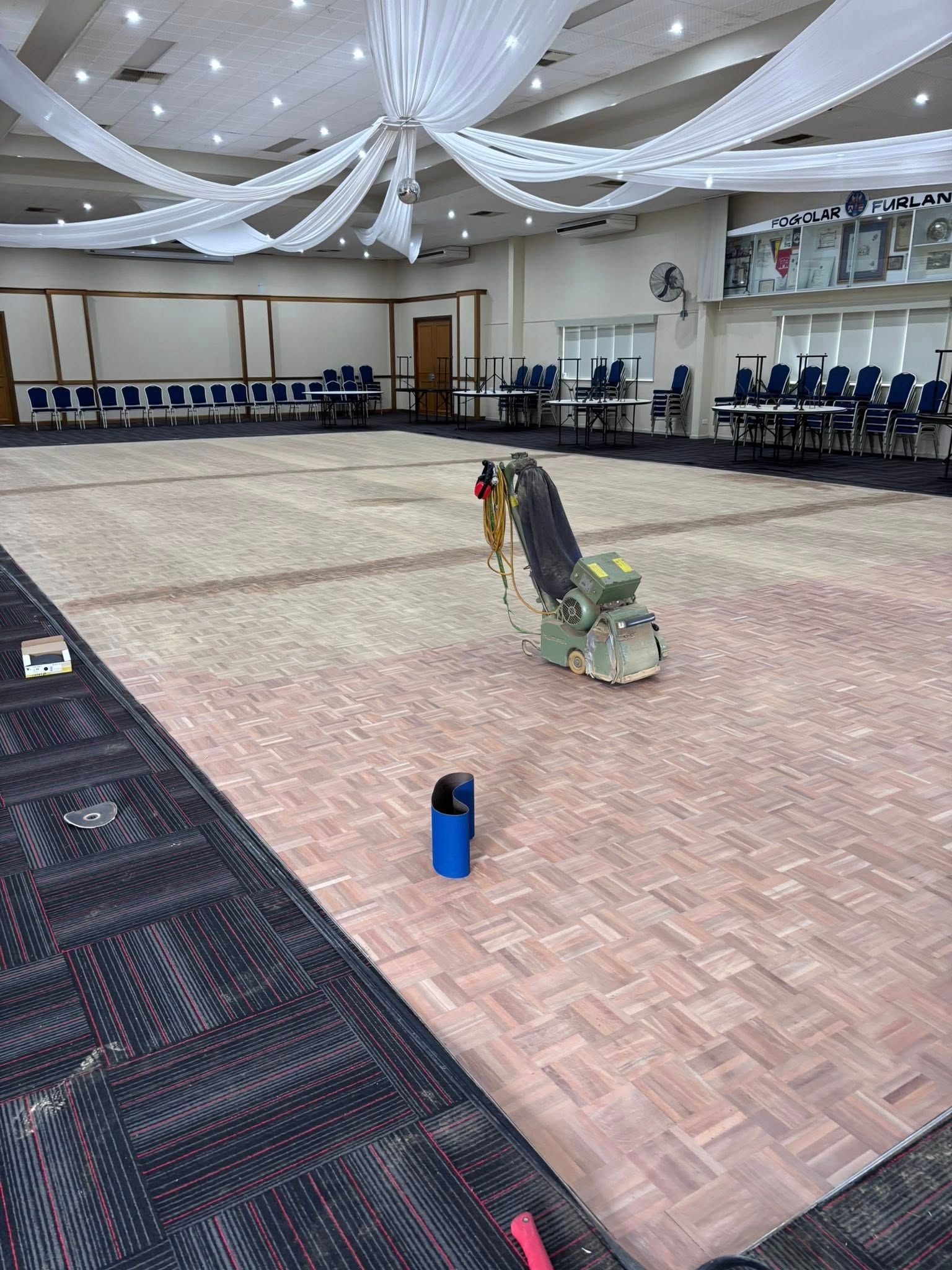 Polished, Reddish-brown Wooden Floor in a Room — Scott Johnston Floor Sanding in Bentley Park QLD