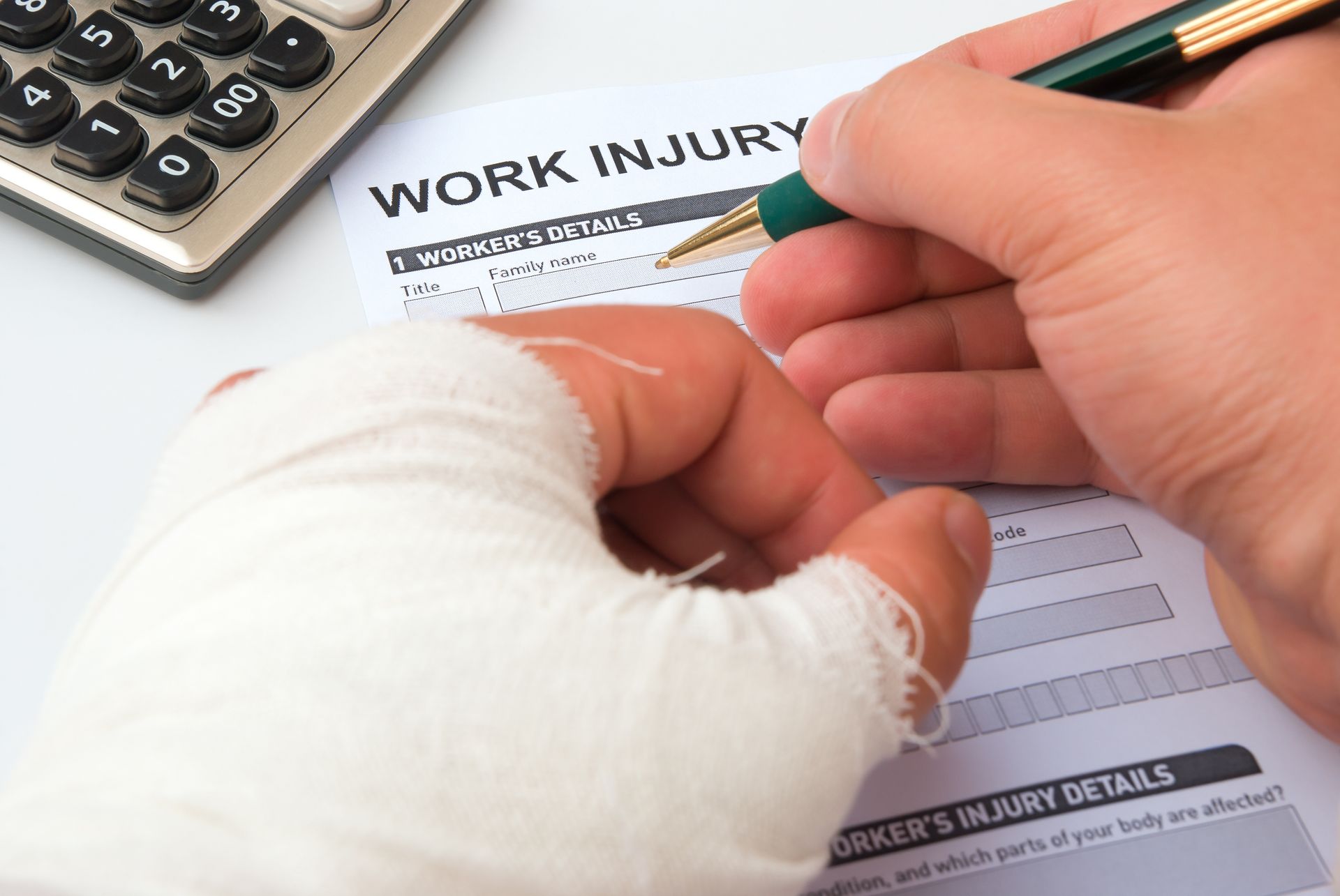 injured worker filling out a workers' compensation claim form