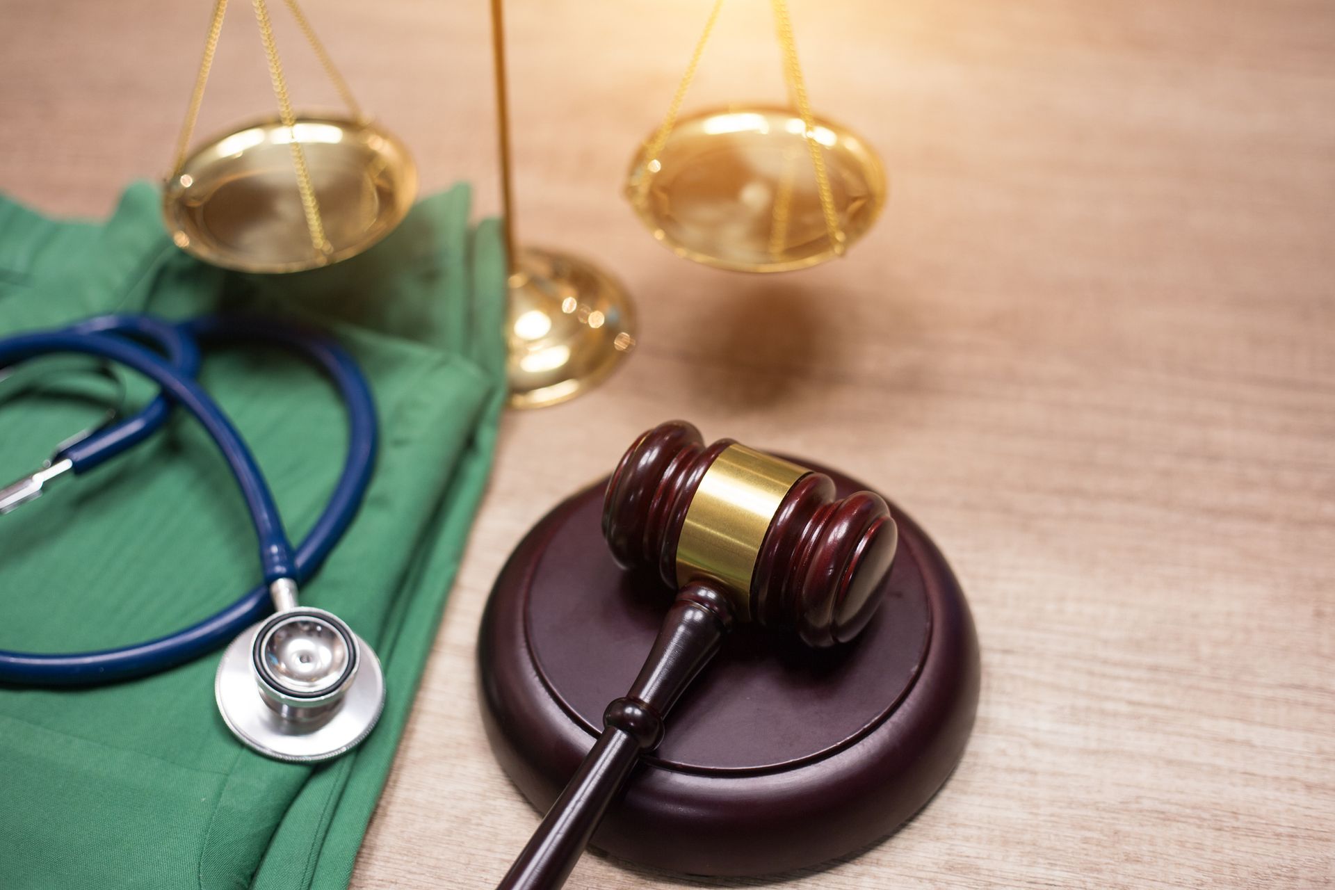 Gavel and stethoscope background with medical laws and legal concepts highlighted. Gavel and stethoscope background with medical laws and legal concepts highlighted.
