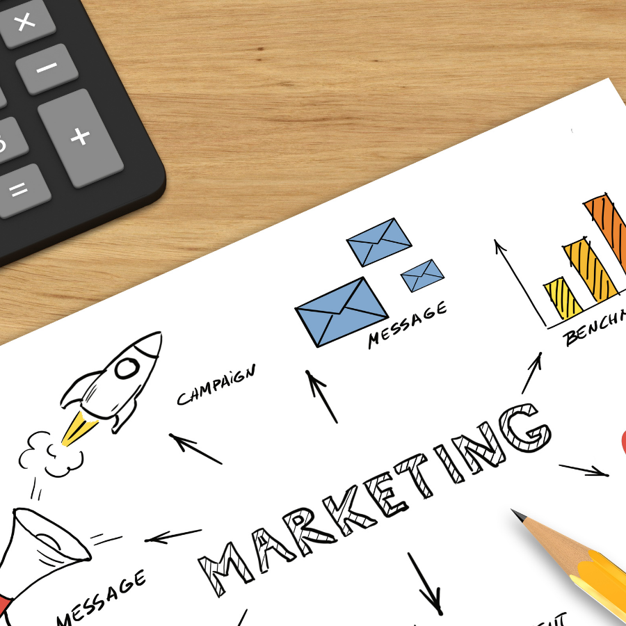 Marketing sketch with rocket, messages, charts, and pencil on a desk