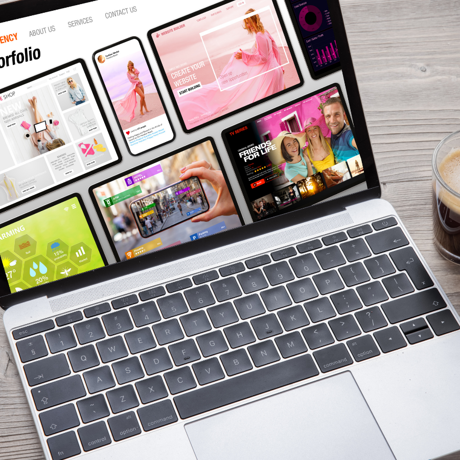 Open laptop displaying a colorful portfolio website on a desk