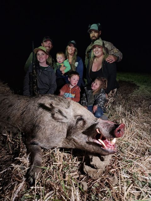 Sam McGuire and Colby Williams with family, owners of California hunting guide service