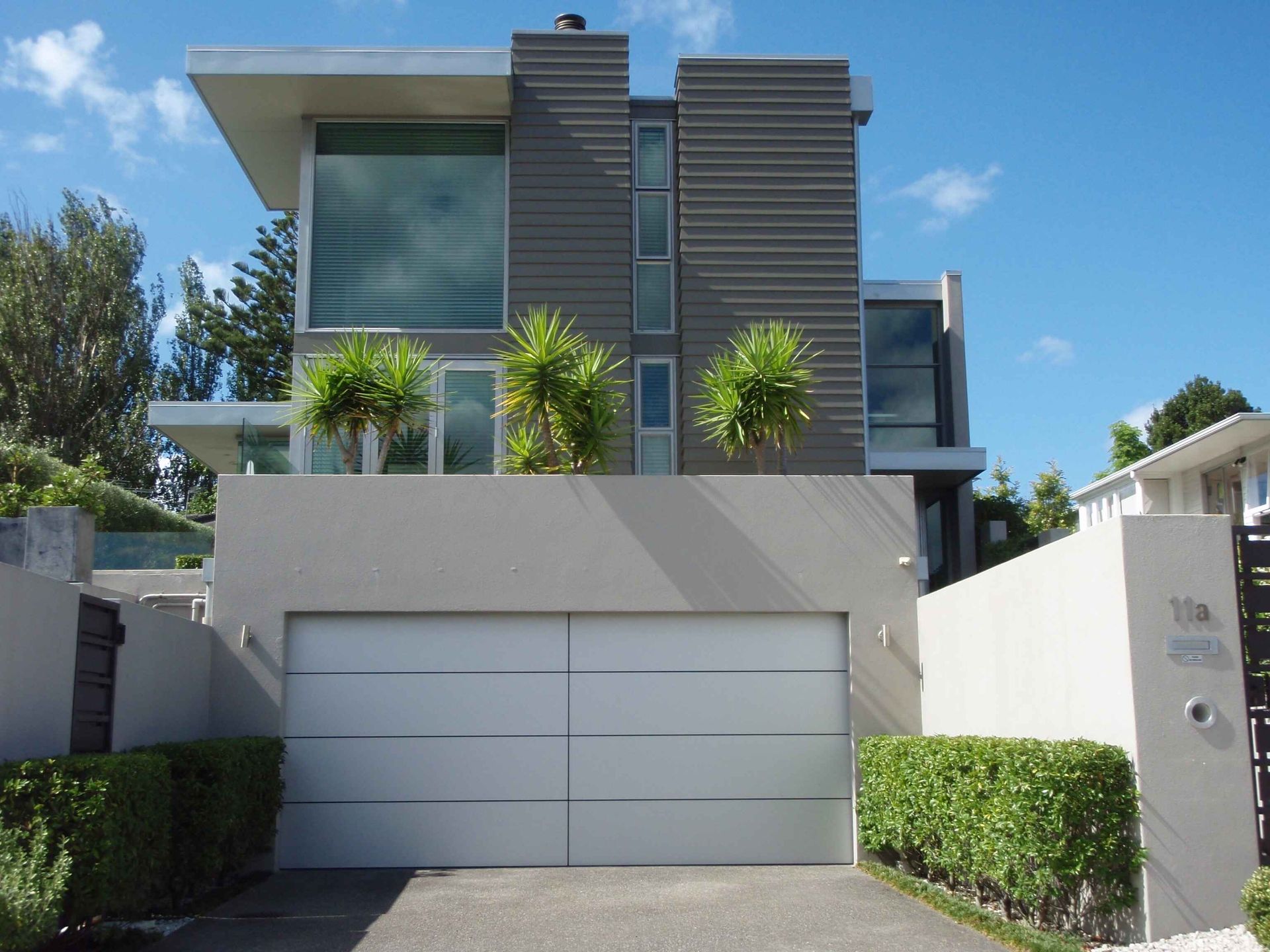 A large modern house with a white garage door