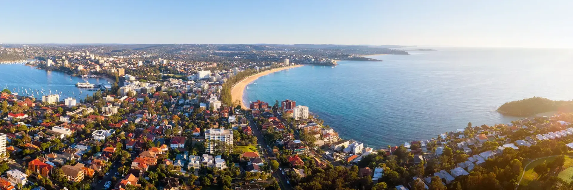An aerial view of a city and a body of water.
