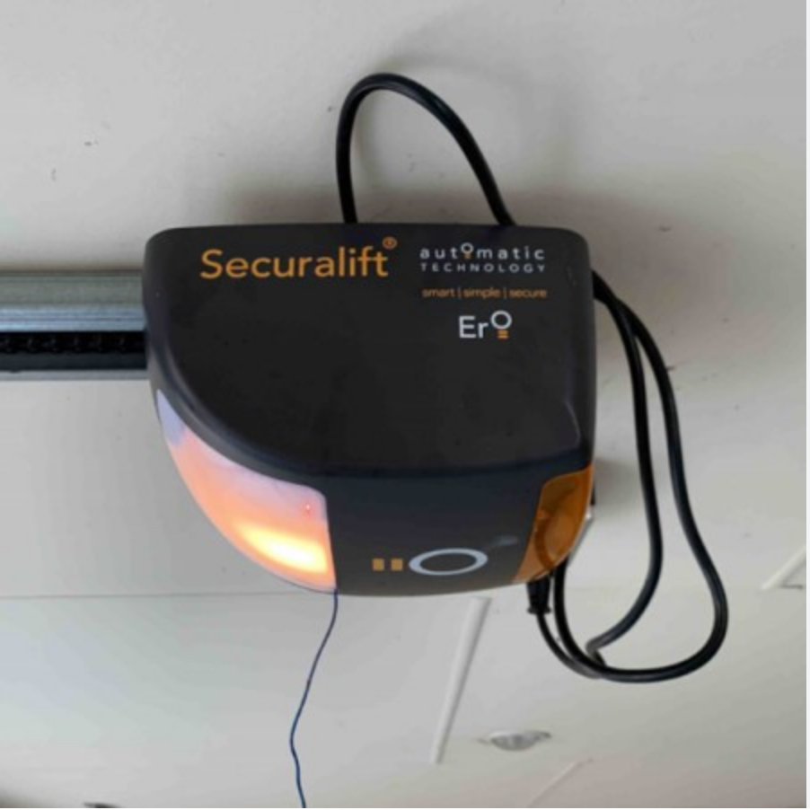 A black securalift automatic technology garage door opener