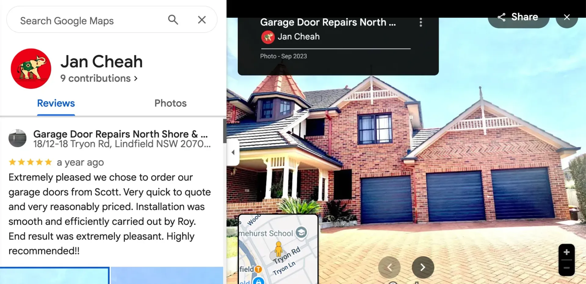 A picture of a brick house with blue garage doors
