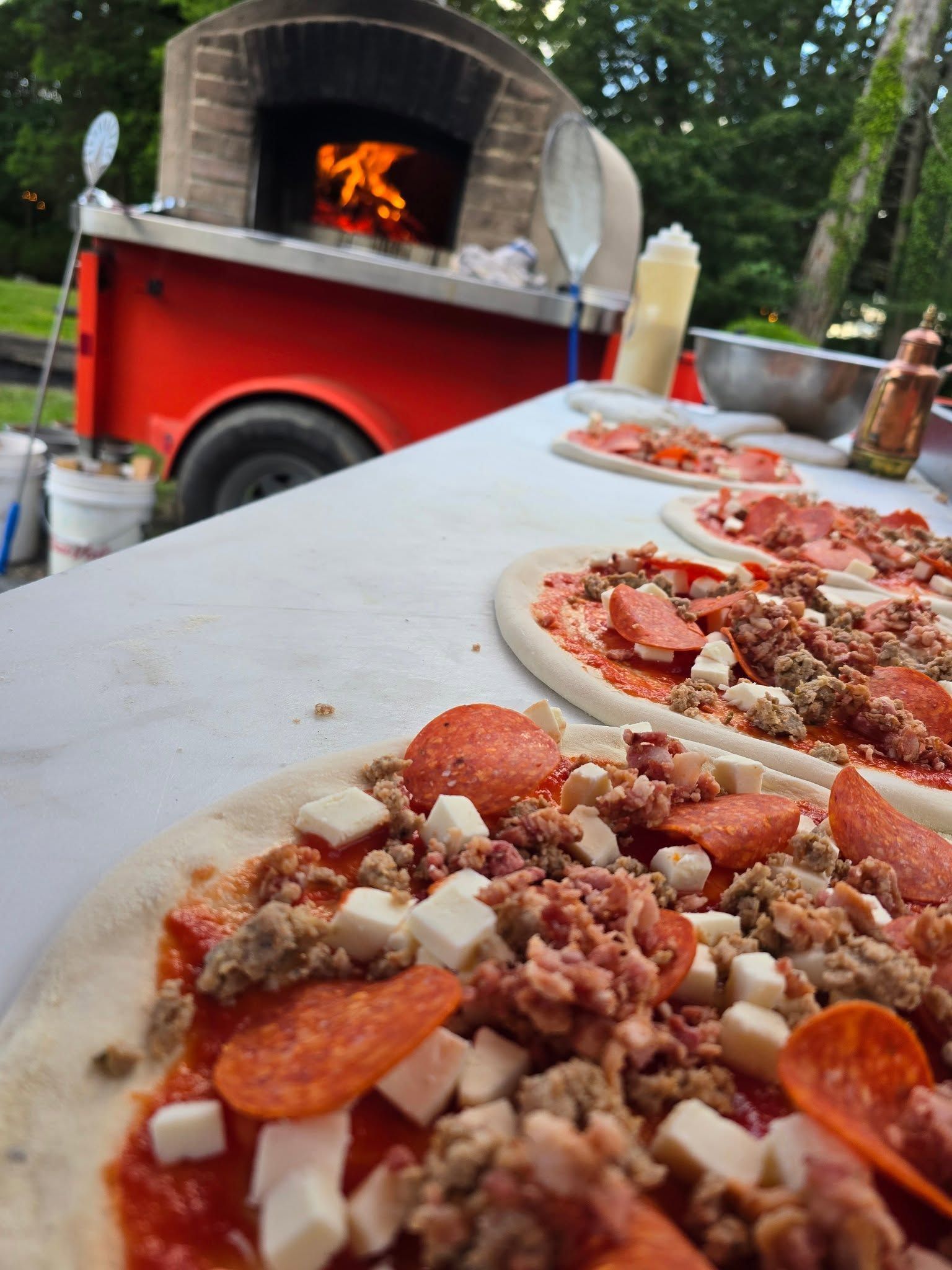 pizzas before going into oven