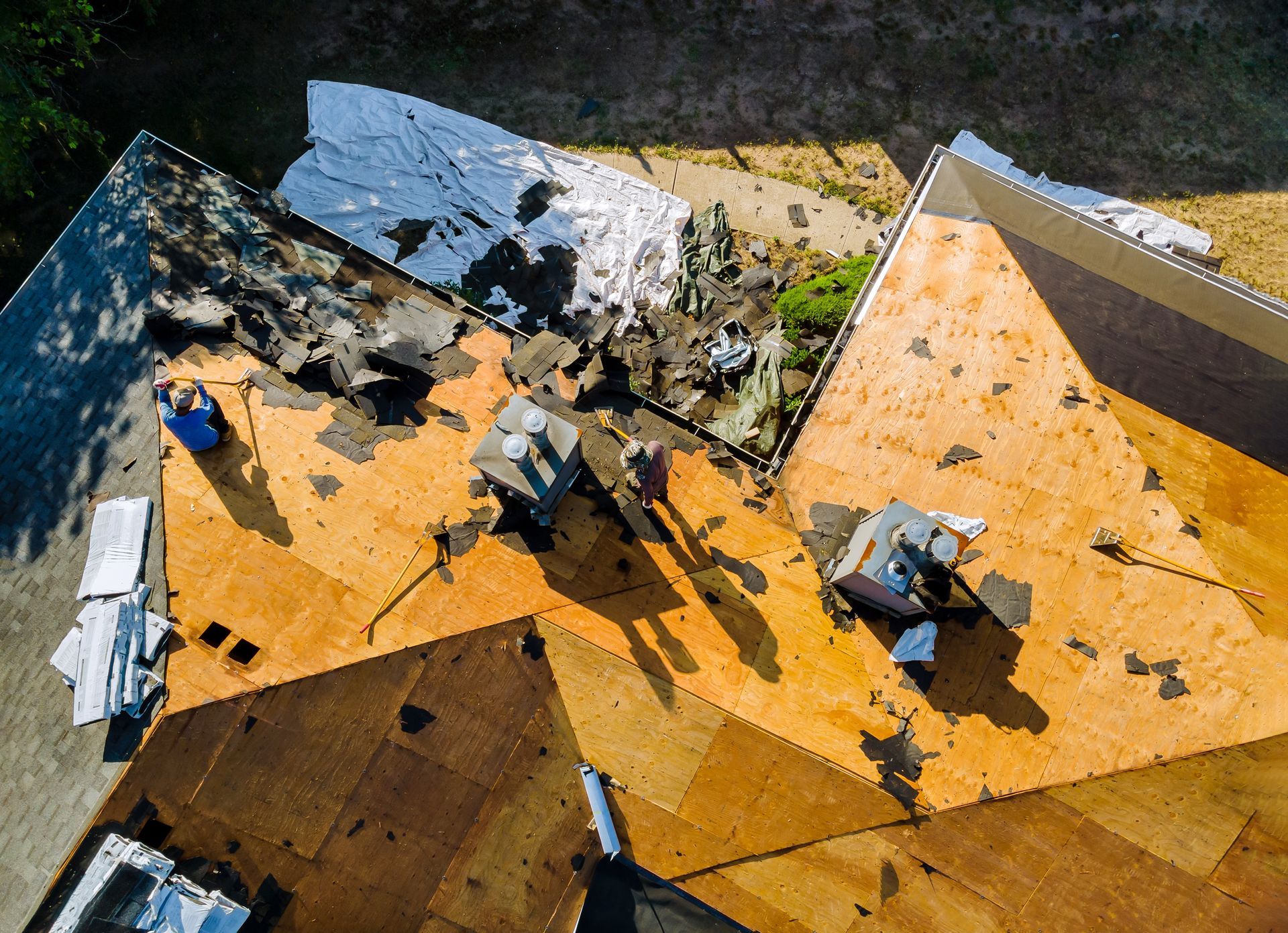 Rooftop with scattered debris and damaged panels in yellow, white, and dark gray.