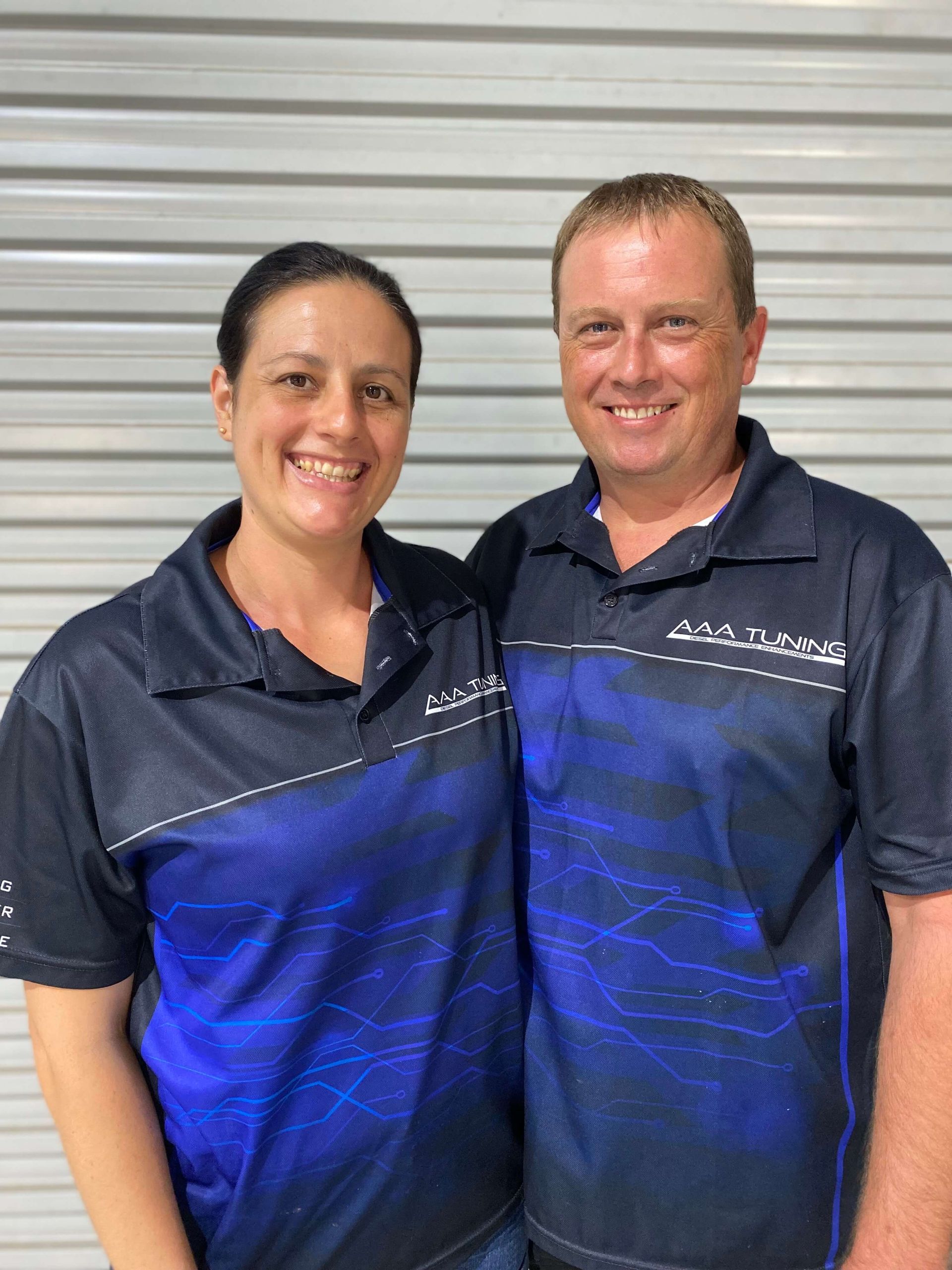 Alan and Anna Abercrombie are standing next to each other and smiling.