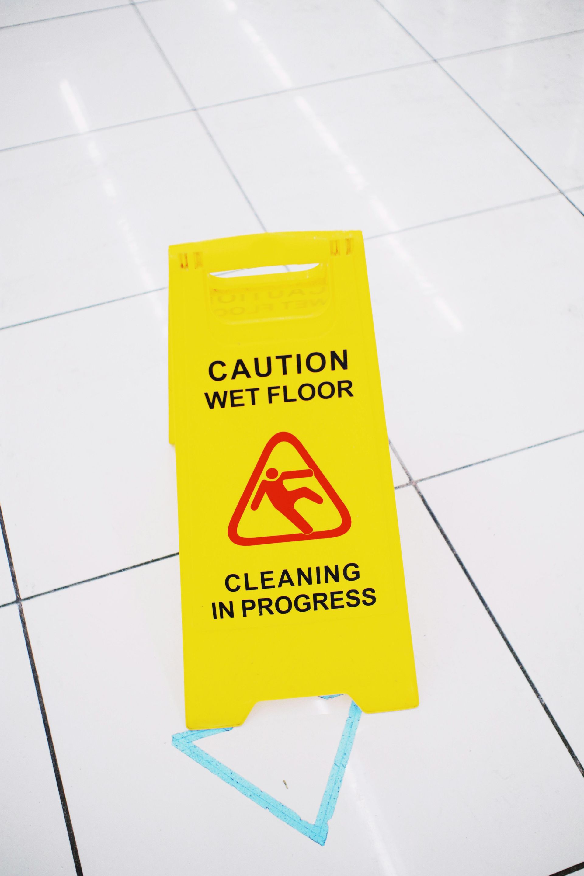 A yellow caution sign with the text 