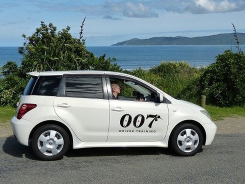 A white car with the number 007 on the side