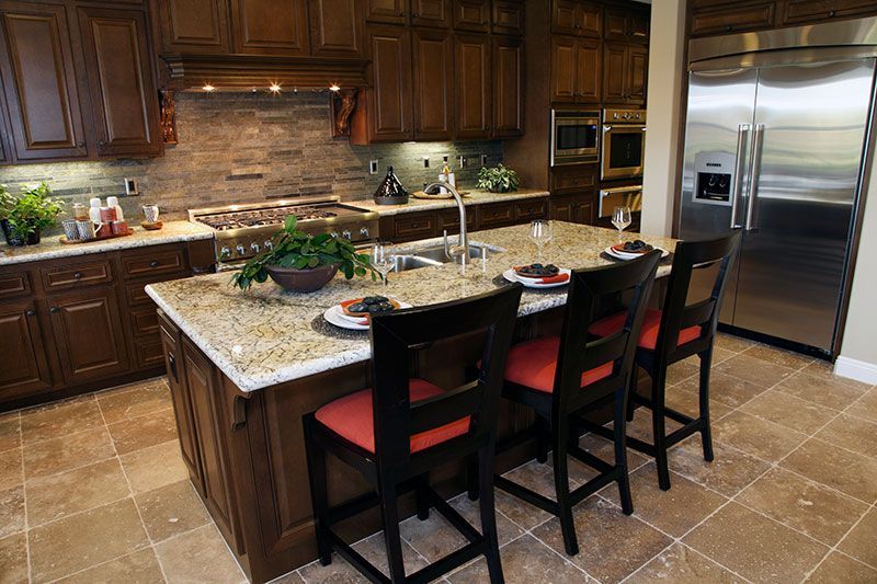 A kitchen with stainless steel appliances and granite counter tops