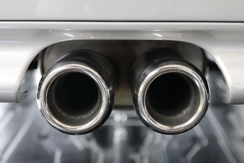 A Close Up of the Exhaust Pipes of a Car — Sprint Mufflers, Exhausts & Mechanical Repairs in Stuart, NT