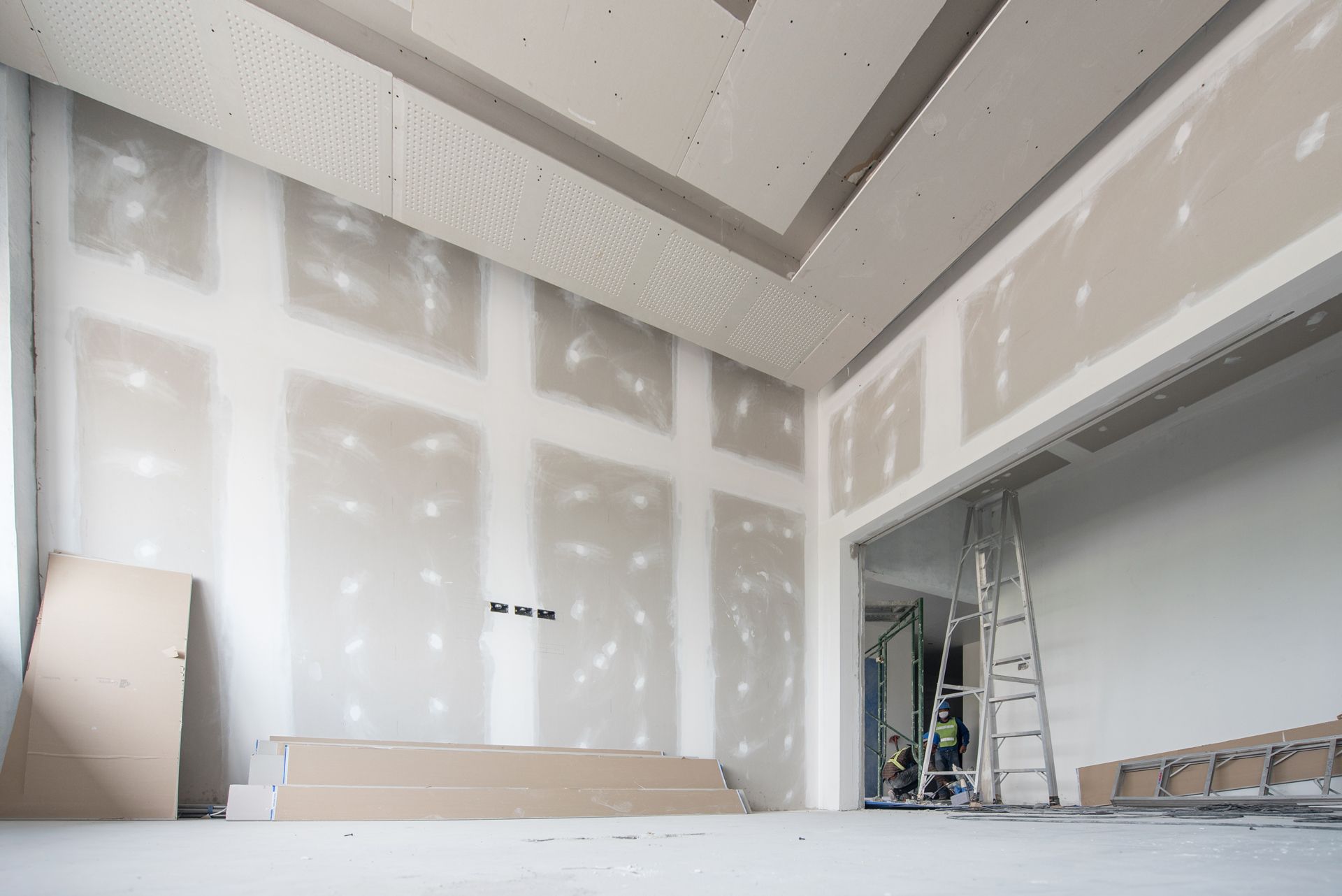 Drywall installation on walls and ceiling.
