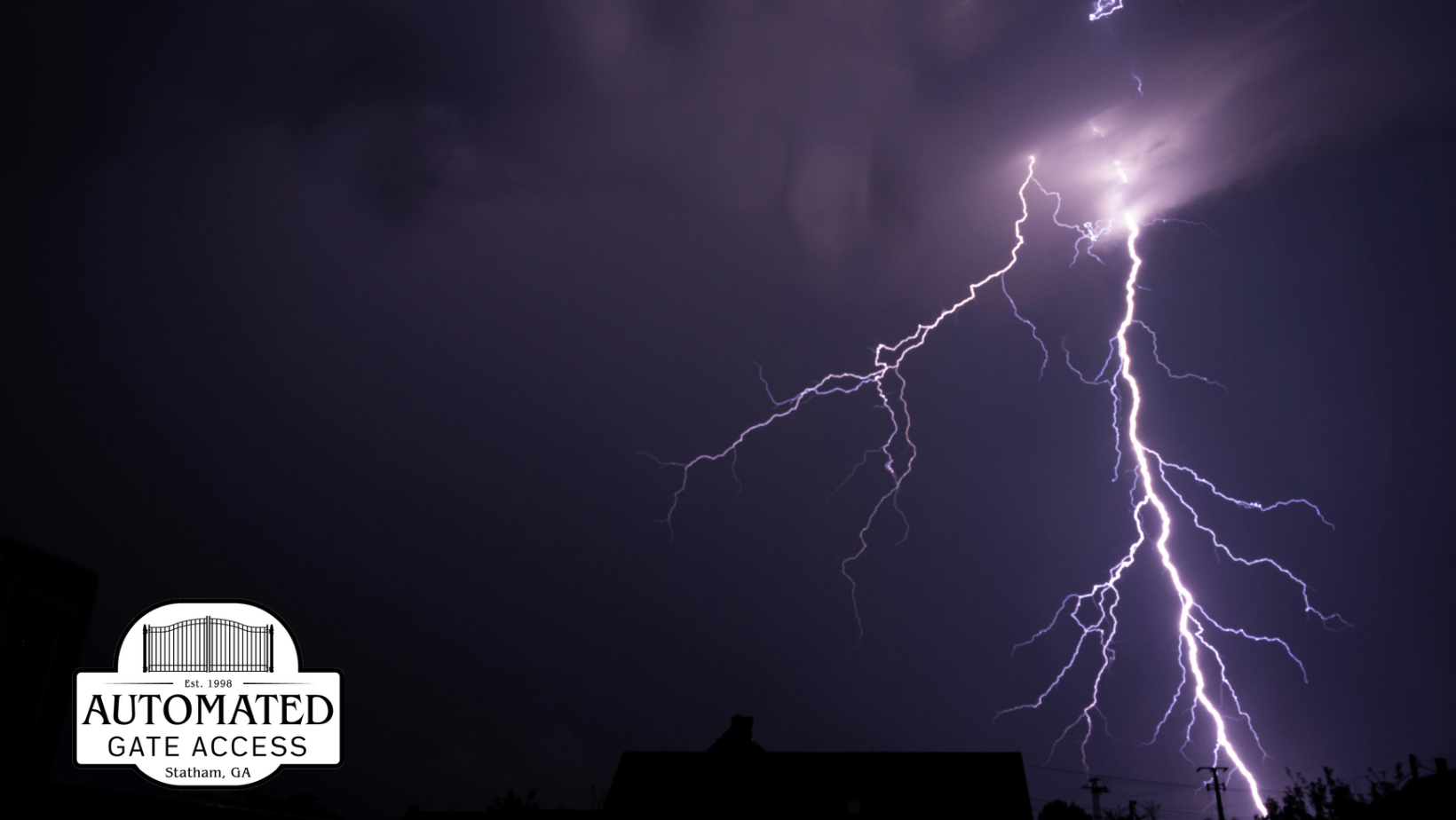 Lightning bolt strikes through dark, stormy sky.