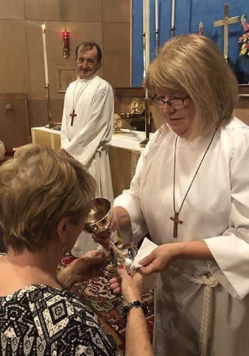 Parishioner receiving holy communion