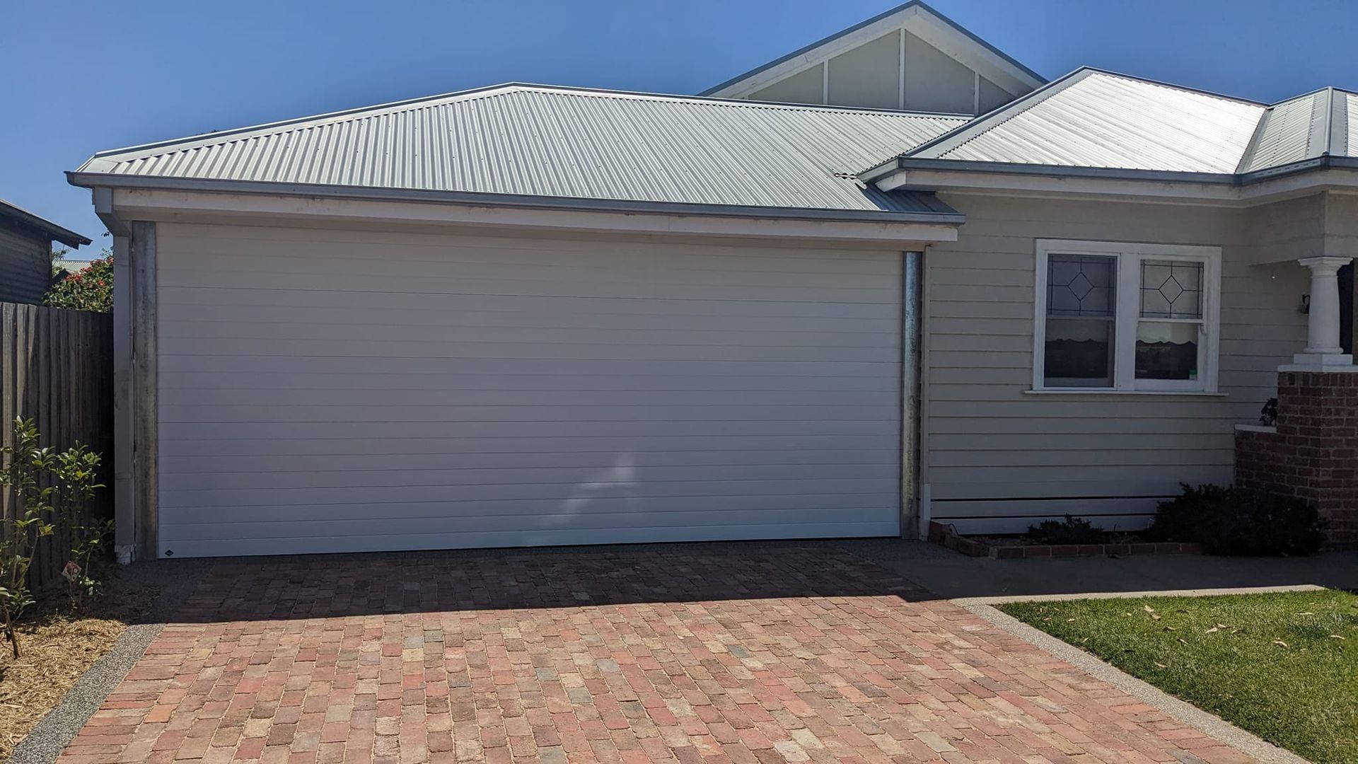 A White Roller Garage Door on a House — Goldfields Garage Doors & Gates in Wendouree, VIC