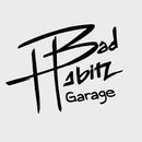 A logo with the words "Bad Habitz" in stylized white text and "Garage" below, set against a dark background.