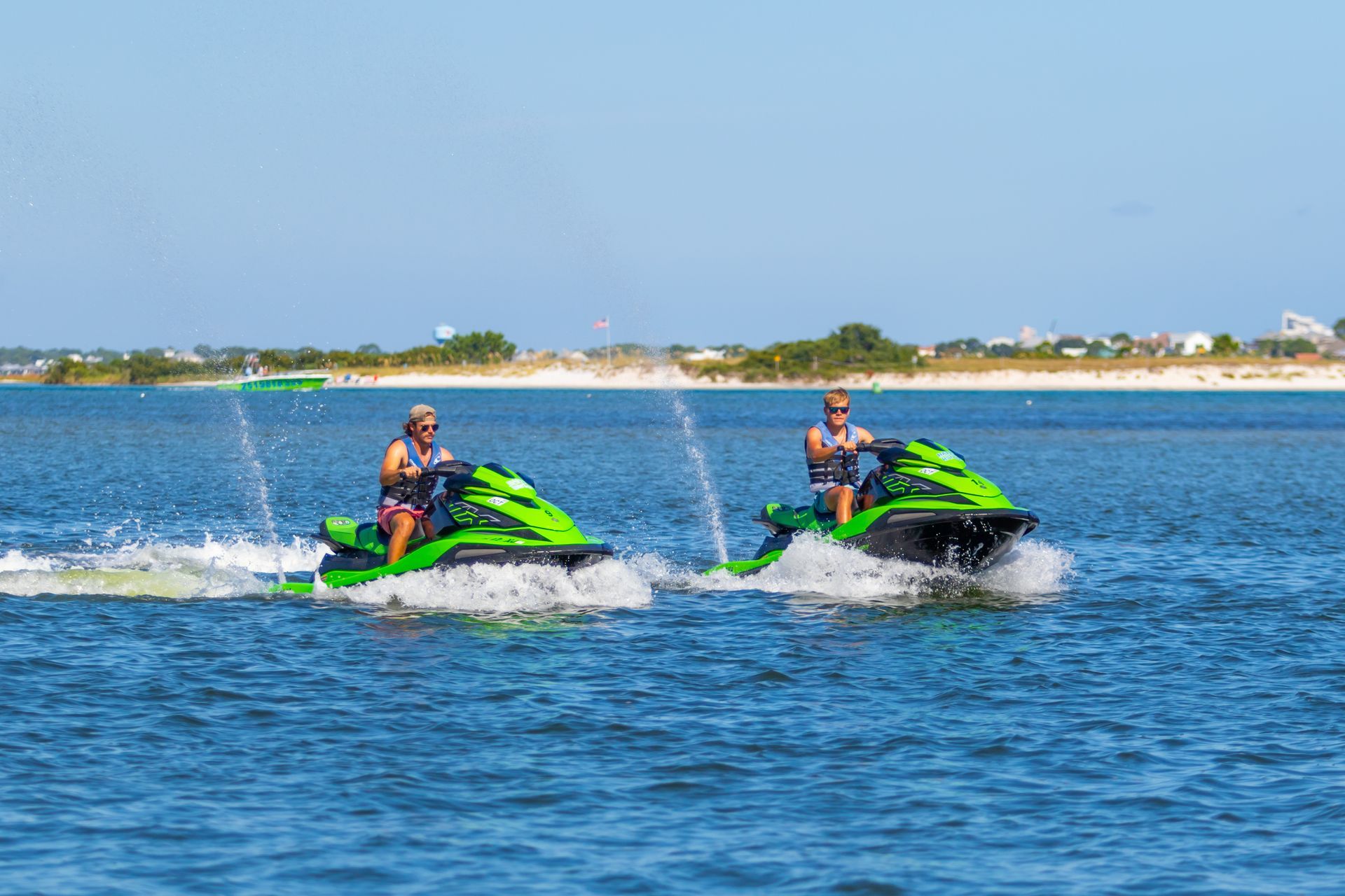 Two people riding on waverunners in Orange Beach, AL.