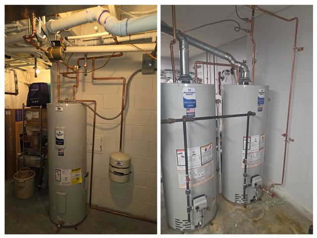 Basement utility room with two water heaters, pipes, and a small expansion tank against a concrete wall