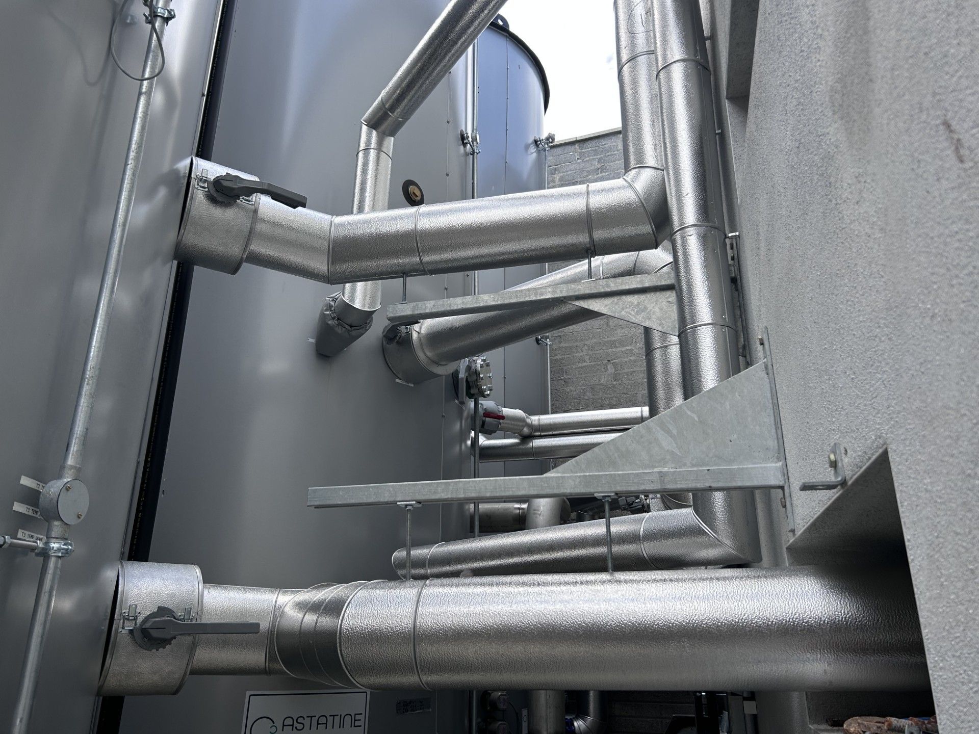 Aluminium cladding installed on external pipework in a new distillery