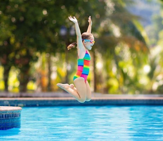 Young Child Jumping Into Pool in Katy, TX