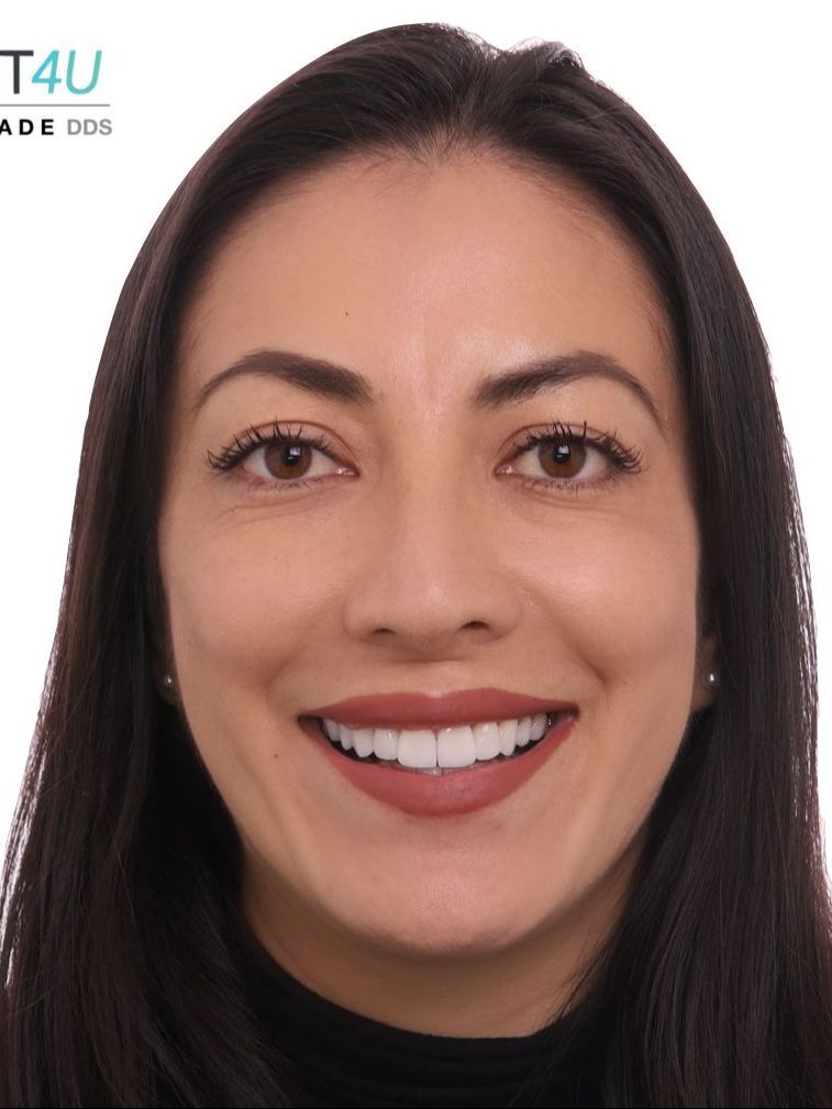 A woman is smiling for the camera with a t4u logo in the background