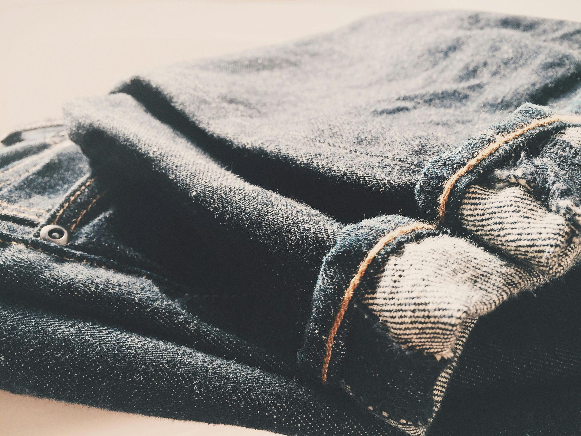 A close up of a pair of jeans on a table