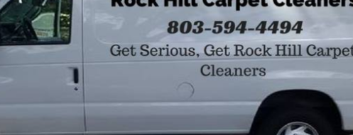 White van with "Rock Hill Carpet Cleaners" text and phone number, with tagline "Get Serious, Get Rock Hill Carpet Cleaners."