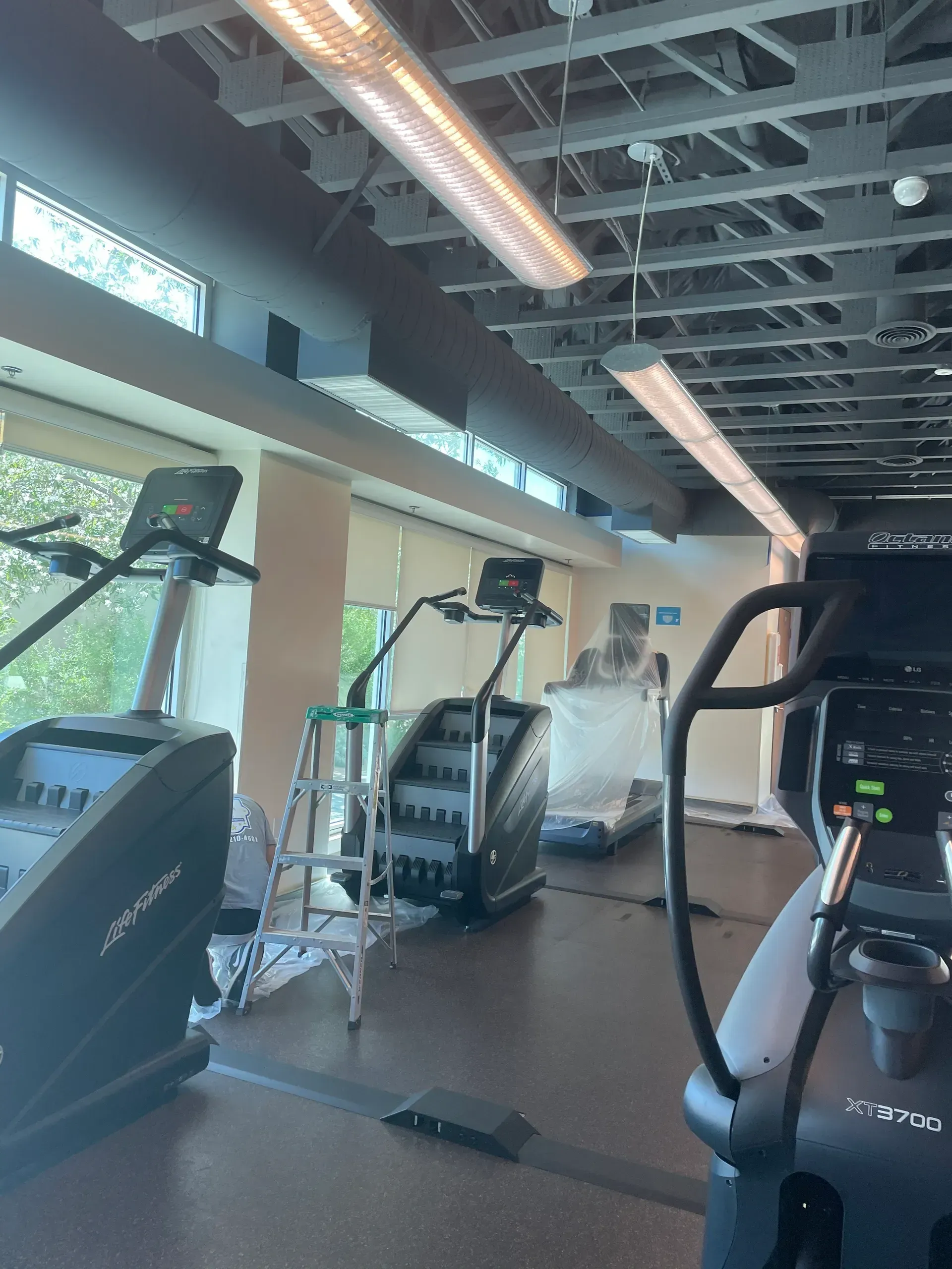 A gym with treadmills and stair climbers